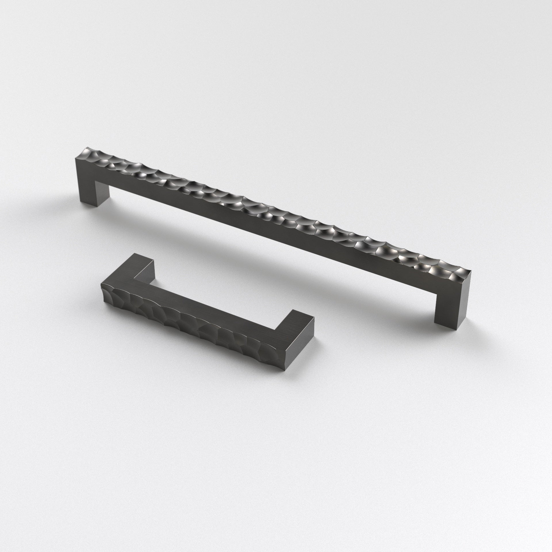 two dark bronze-finished brass hammered cabinet pulls. The Lapworth Cabinet Pull displayed here against a white background.