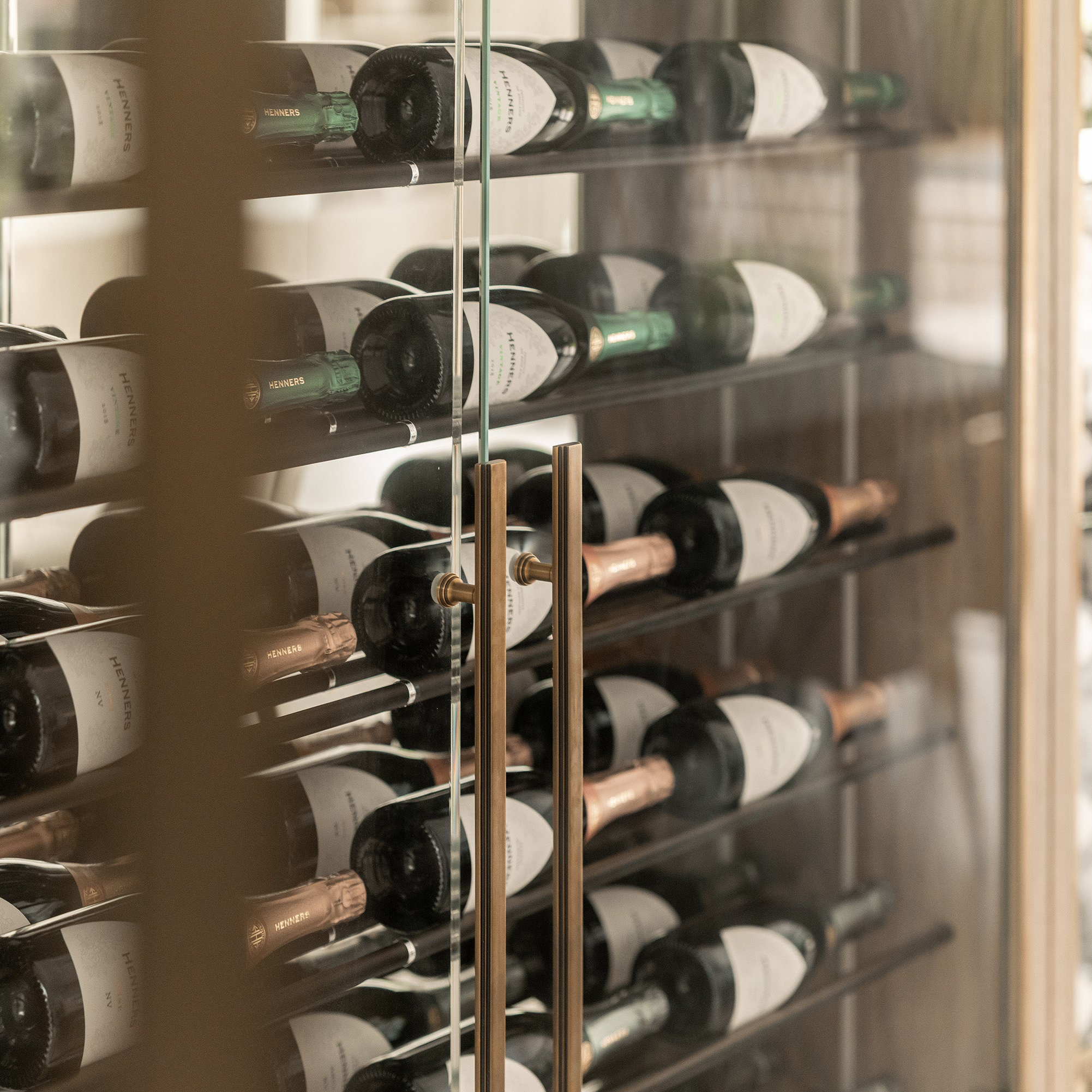 Tanworth Appliance Pull installed on a glass wine cellar door.