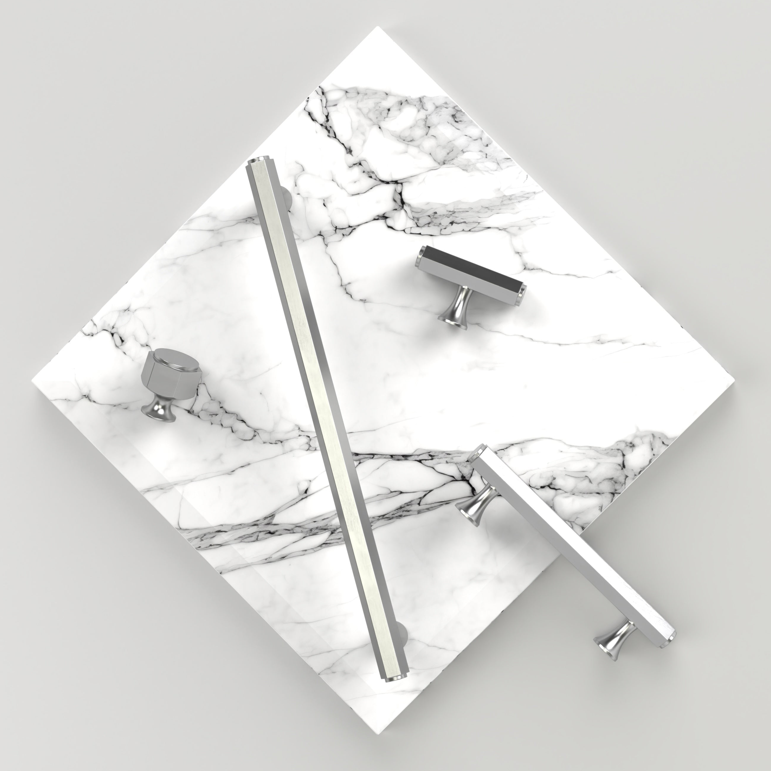 Marble surface with satin nickel 'battersea' cabinet hardware on a light grey background