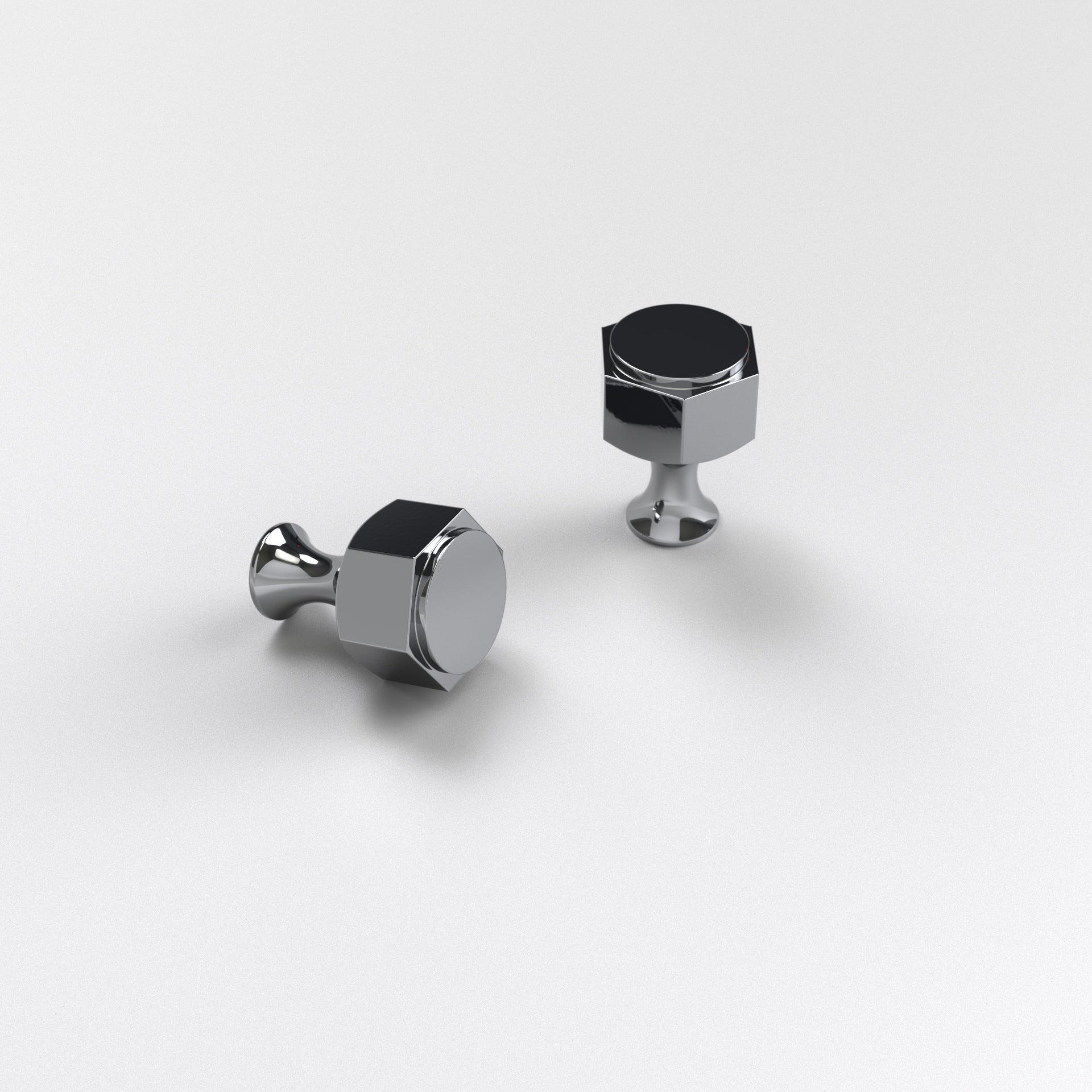 two polished chrome-finished brass hexagon cabinet knobs. The Oxford Cabinet Knob displayed here against a white background.