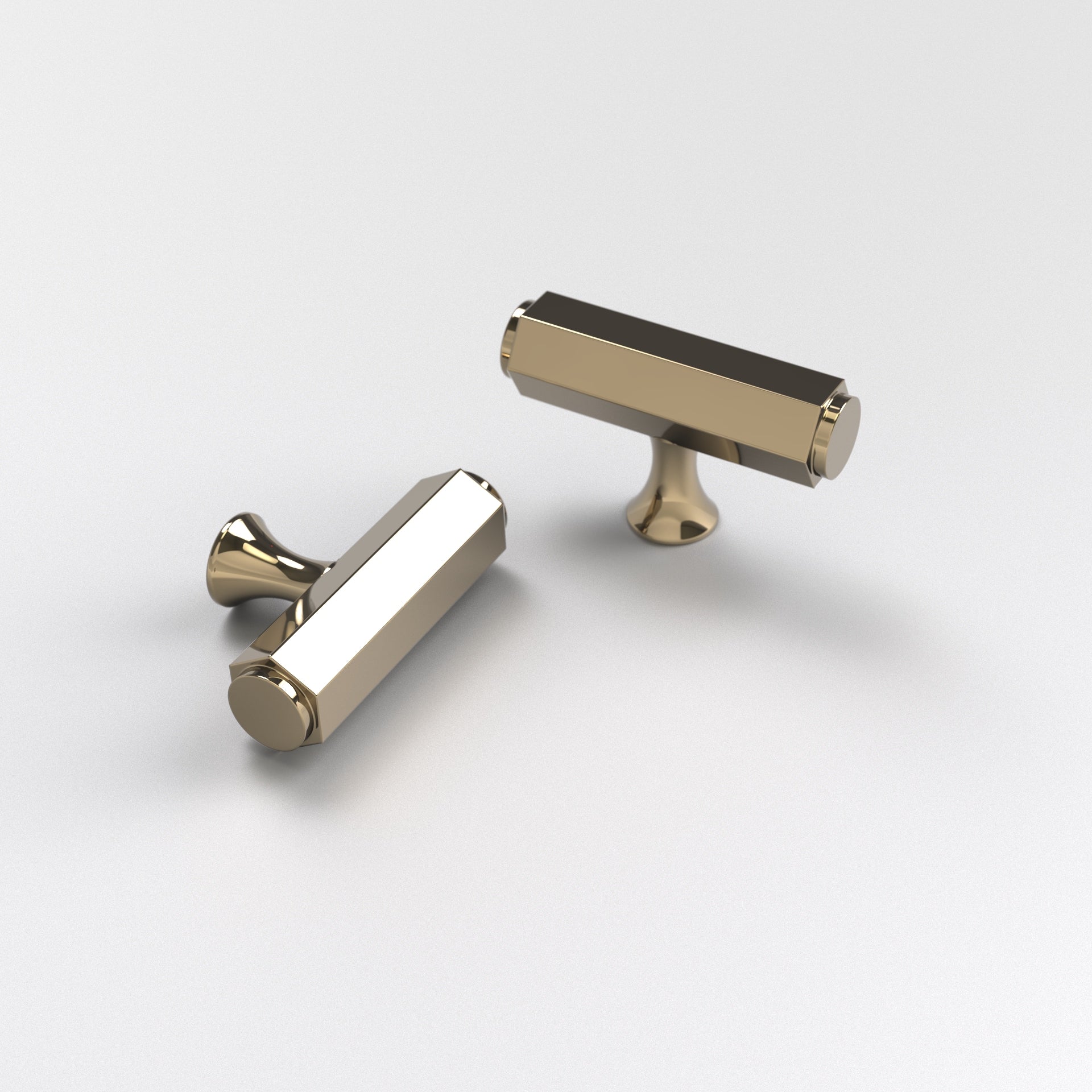 two polished brass-finished brass hexagon t-bar cabinet pulls. The Battersea T-Bar Cabinet Pull displayed here against a white background.
